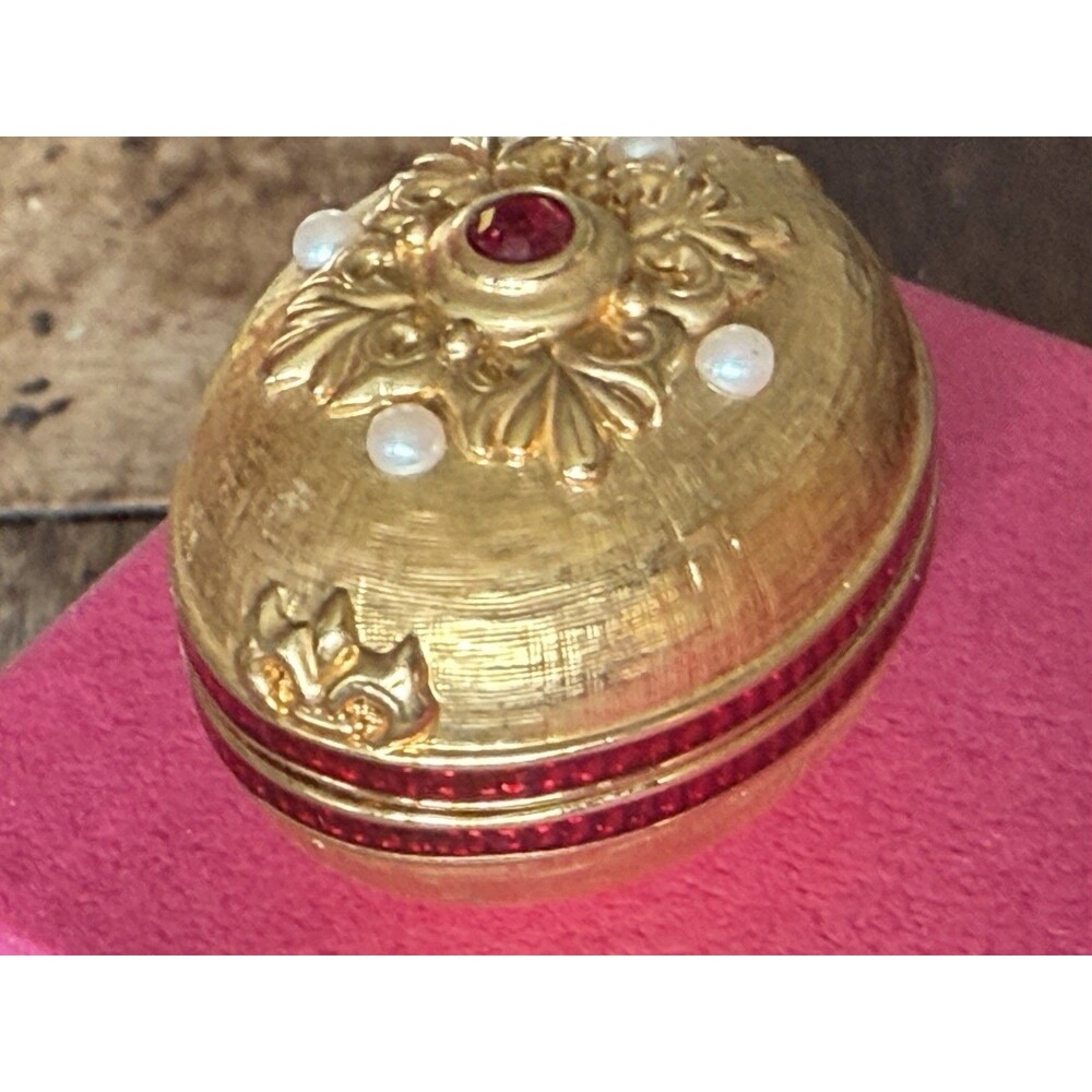 Vintage ornate gold-tone trinket box with faux pearls and ruby-red stone